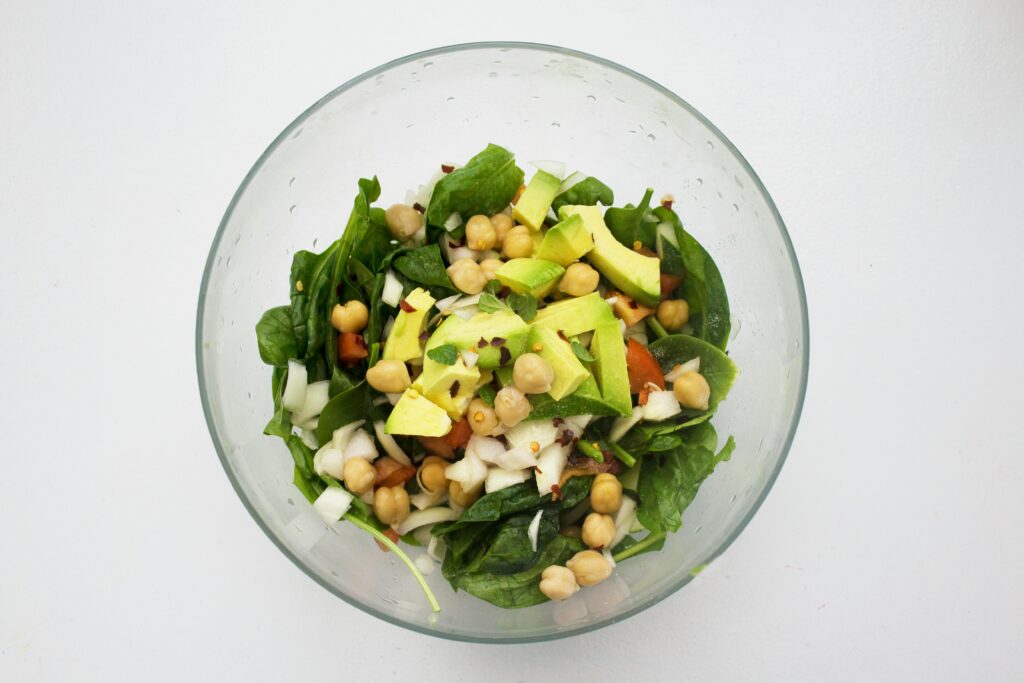 a bowl of salad with vegetables and chickpeas