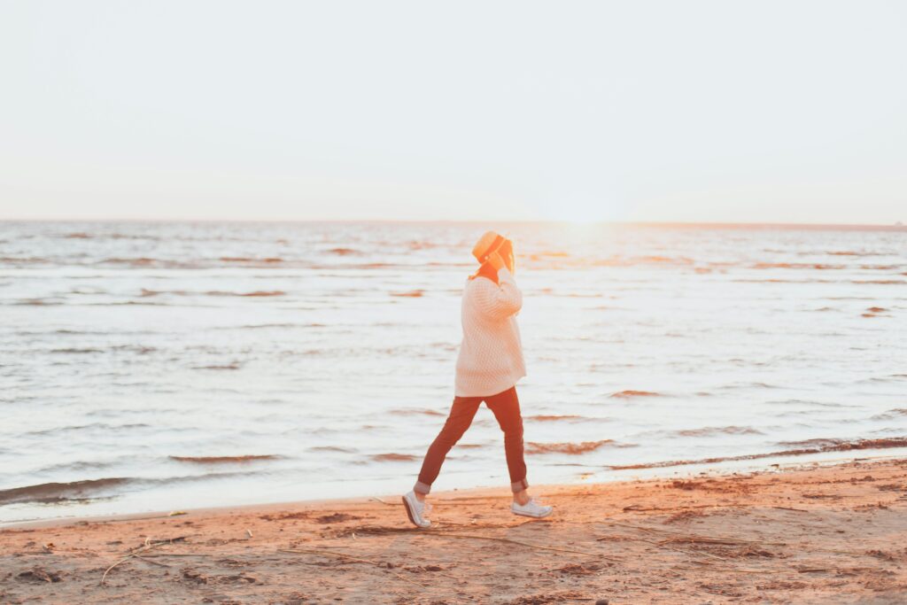 a person walking on a beach