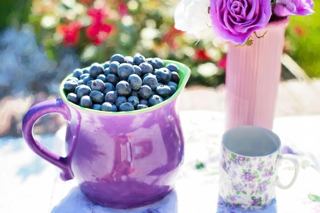 a purple cup full of blueberries