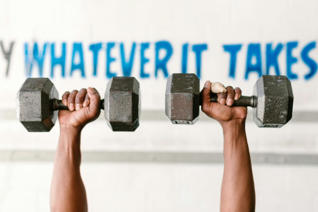 a person lifting weights in a row