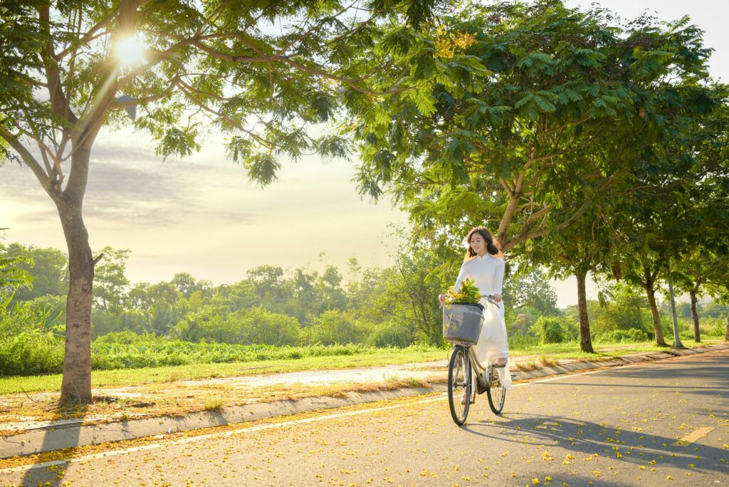 a woman riding a bicycle with a basket on it