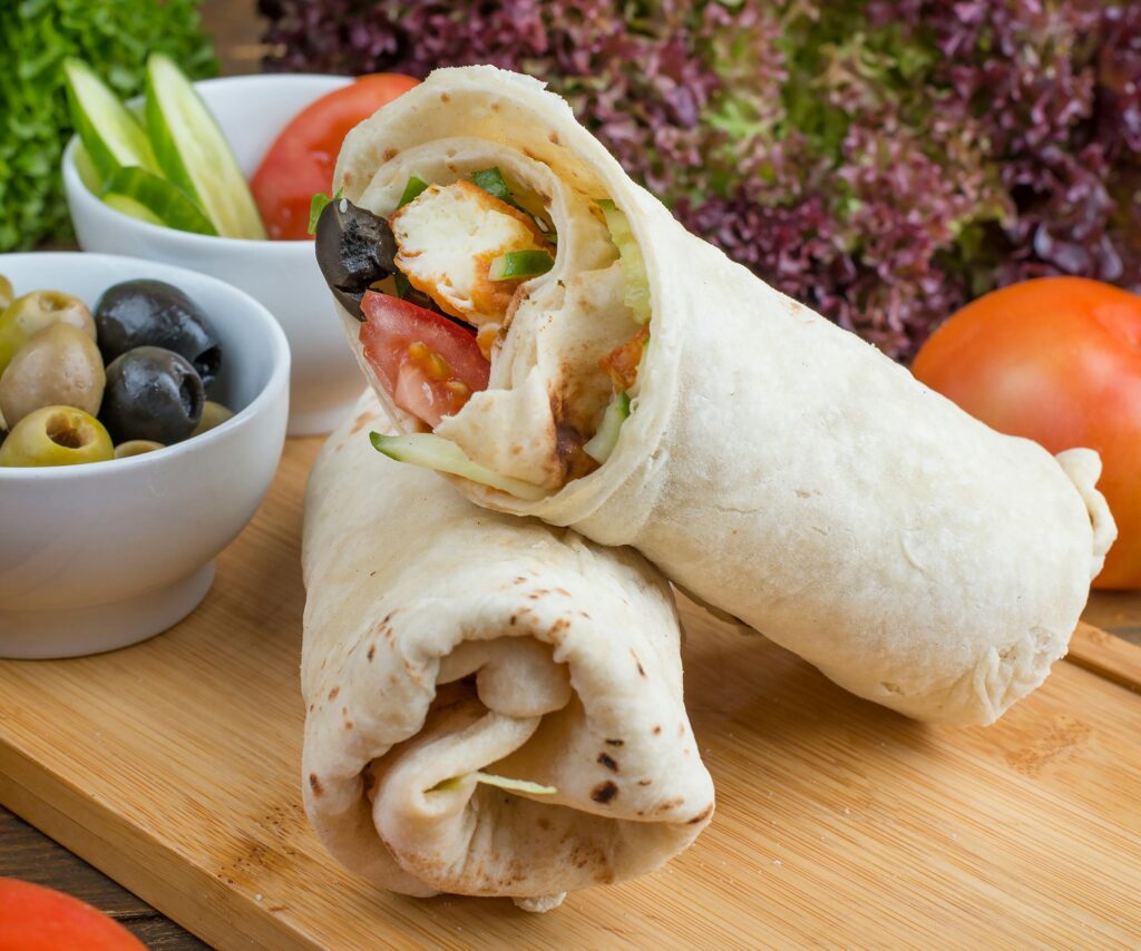 a burritos on a cutting board